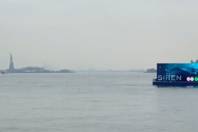 The barge passing in front of the Statue of Liberty earlier this month